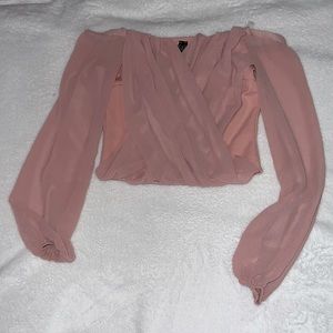 Windsor strapless pink top, with sheer sleeves.